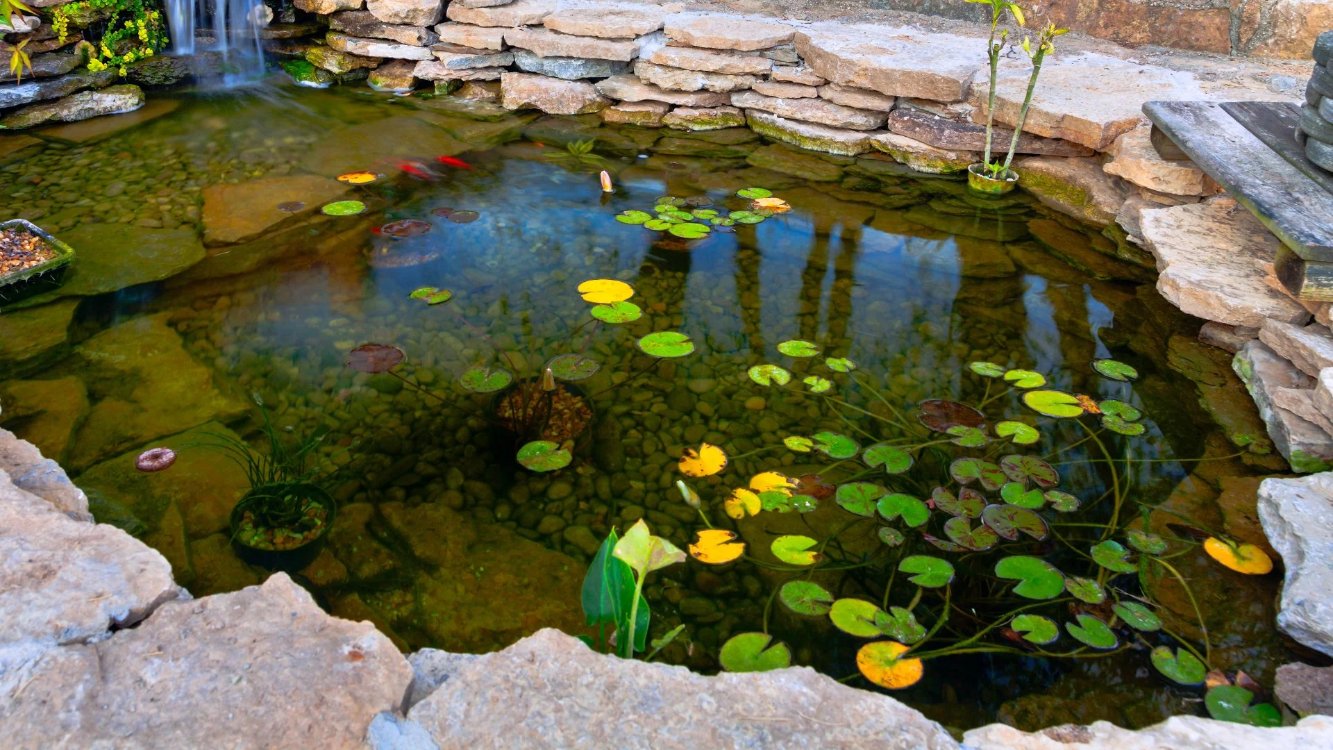 A beautiful rock waterfall professionally installed by our skilled employees at a home in West Des Moines, IA.