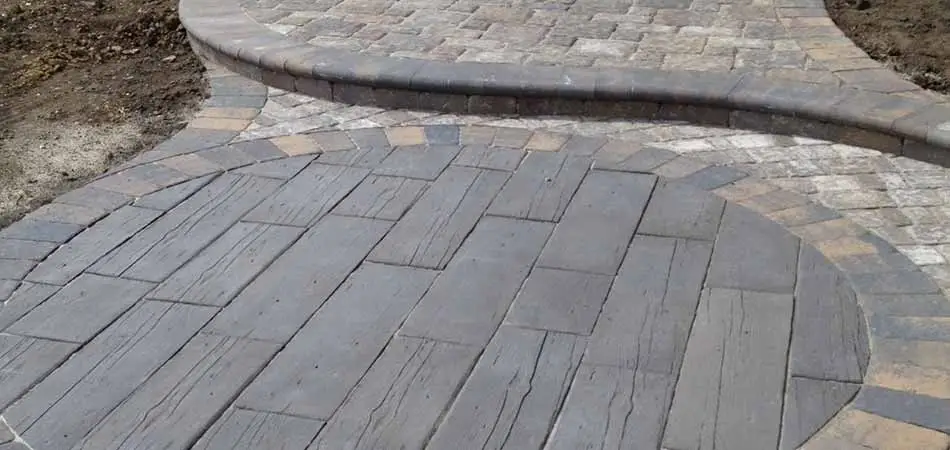 This patio in West Des Moines serves as an example of one that incorporates wood into its design.