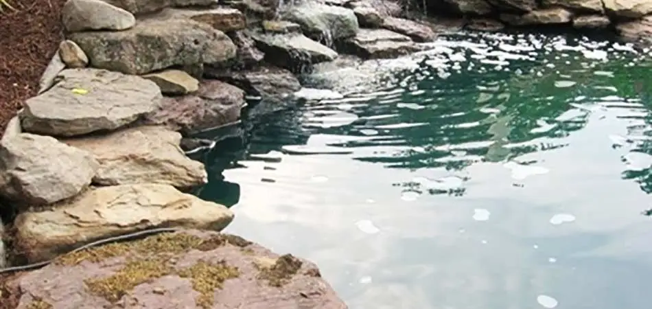 A+ Lawn & Landscape has built this small waterfall with a pond for a homeowner in Des Moines.