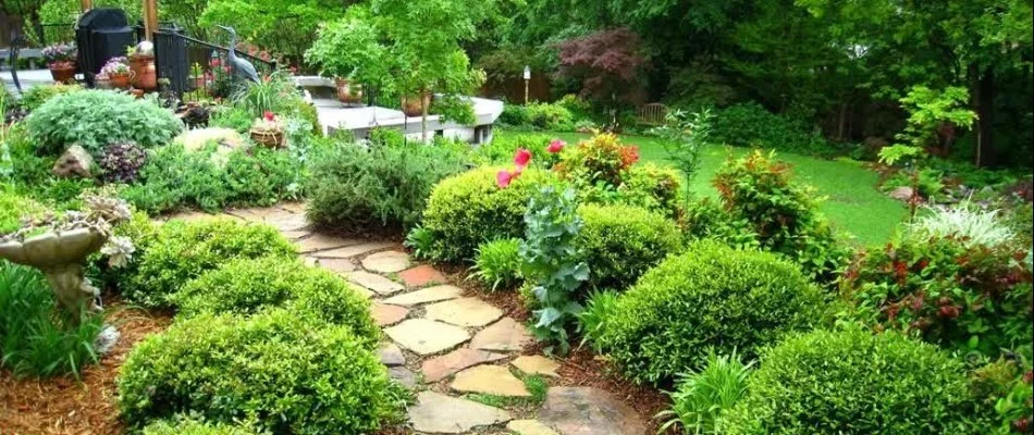 Landscaping with a walkway in the middle on a property in Greater Southside, IA.
