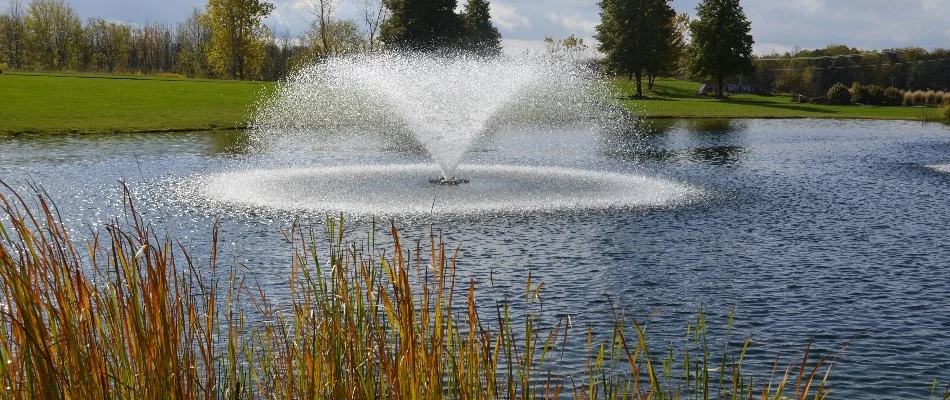 Large pond in Des Moines, IA, with a fountain.