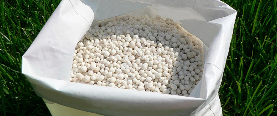 Close up on a white bag of fresh fertilizer to be used on a property in Carlisle, IA.